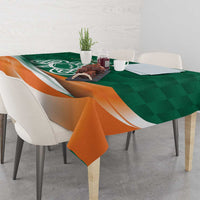 Green and orange shamrock rugby tablecloth with logo, draped over table edge