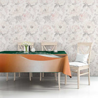 Green and orange shamrock rugby tablecloth on dining table with matching chairs