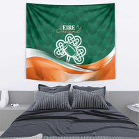 Green tapestry with Celtic knot rugby ball and orange wave stripe