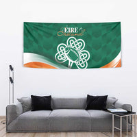 Green rugby tapestry with Celtic knot football and orange wave stripe