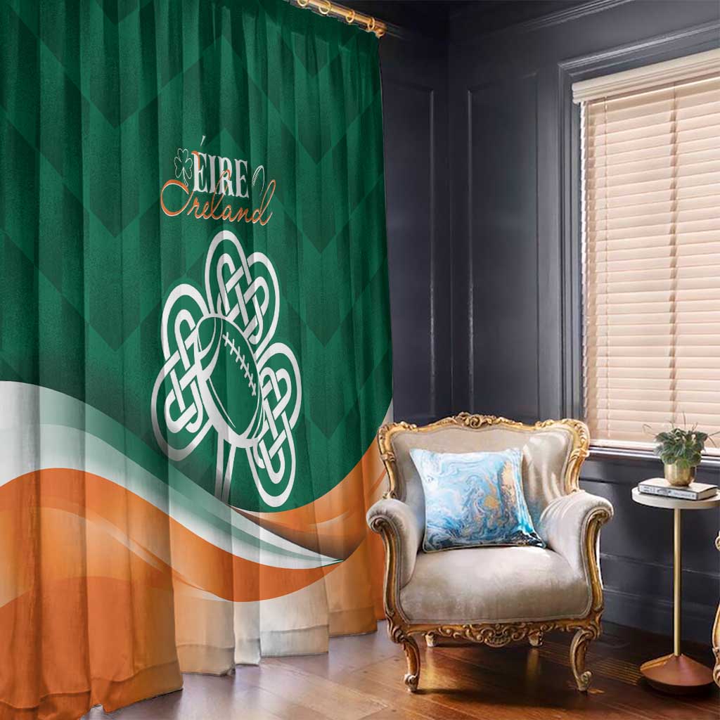Green window curtain with Celtic shamrock emblem and orange lower band