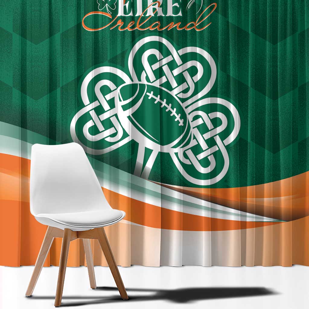 Green window curtain with large Celtic shamrock emblem and orange wave stripe