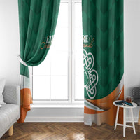 Green window curtain panels with Celtic shamrock emblem and orange bottom wave