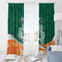 Green window curtain pair with Celtic shamrock emblem and orange wave hem
