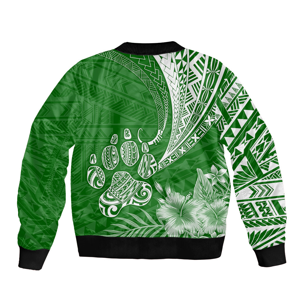 Green bomber jacket with black ribbed hem, white tropical tribal pattern and flowers