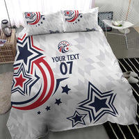 White duvet cover with “YOUR TEXT 07” and navy/red star graphics, two matching pillows