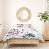 White duvet and pillow with navy/red star graphics and the text “YOUR TEXT 07”