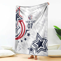 White custom blanket draped over sofa with stars, stripes, and “YOUR TEXT 07”