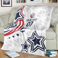 White custom blanket on armchair with stars, stripes, and “YOUR TEXT 07” print