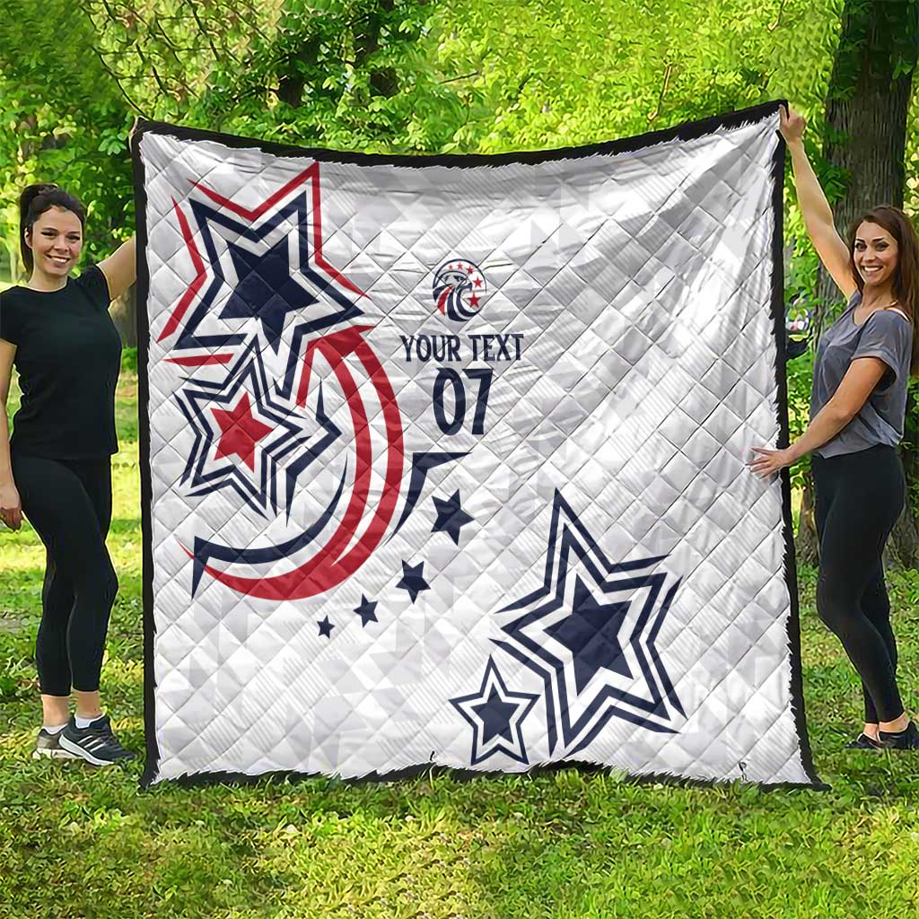 White custom quilt featuring bold blue stars and red patriotic swirl graphic