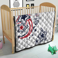 White custom quilt on a toddler bed with blue stars and red patriotic print