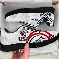 White low-top sneakers with black sole, USA logo and star graphic on side