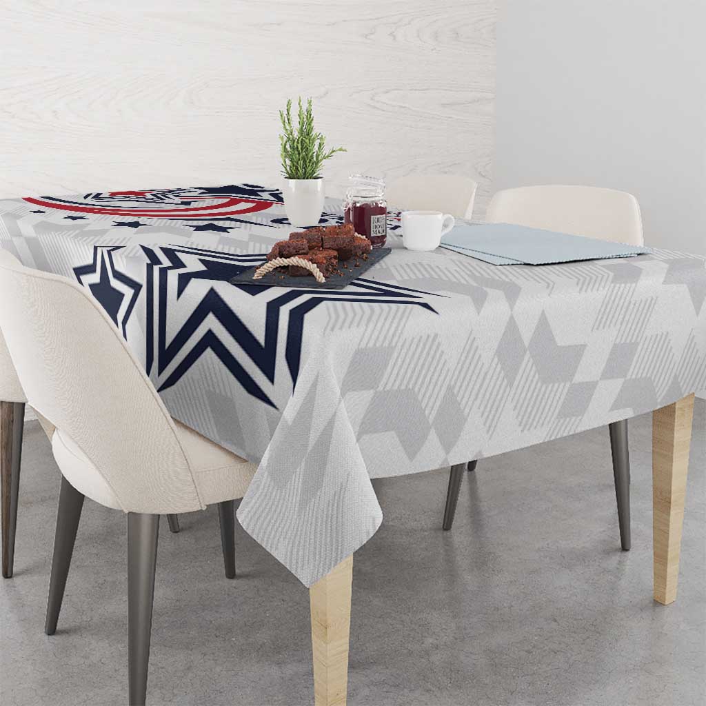White tablecloth with navy star, zigzag stripes, and geometric pattern