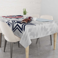 White tablecloth with navy star, zigzag stripes, and geometric pattern