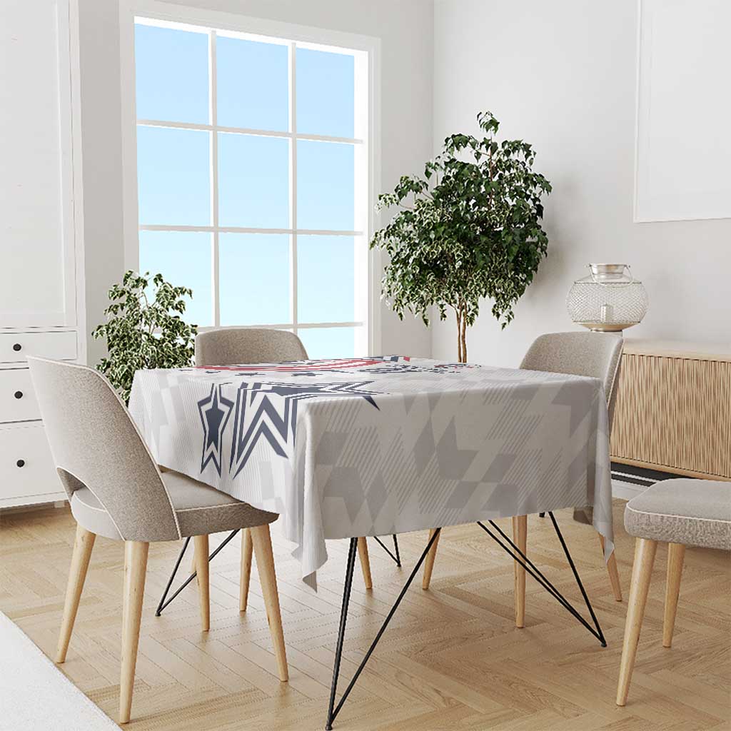 White and gray patterned tablecloth with navy star and chevron design