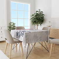 White and gray patterned tablecloth with navy star and chevron design