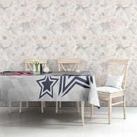 White tablecloth with navy star and stripe motif on gray geometric background