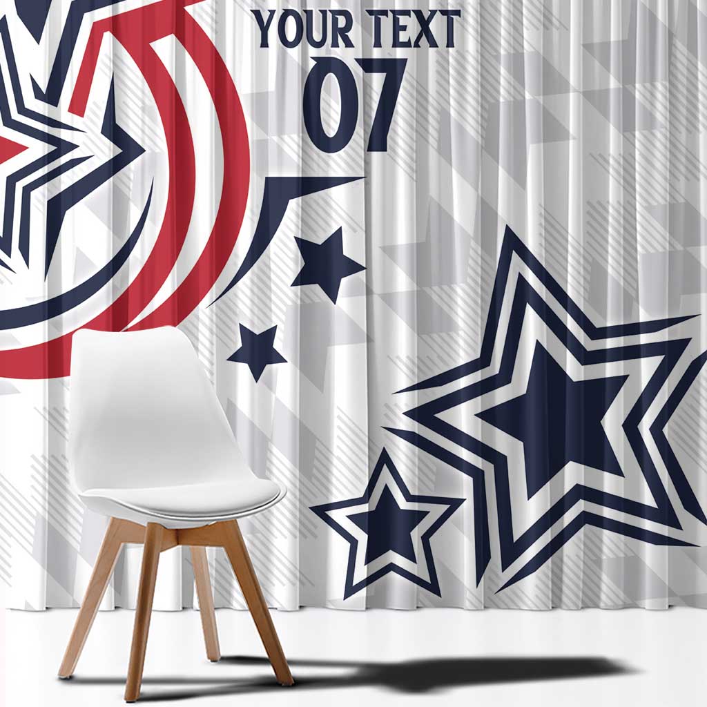 White window curtain with large blue star and red curved stripe design; hanging folds and hem.