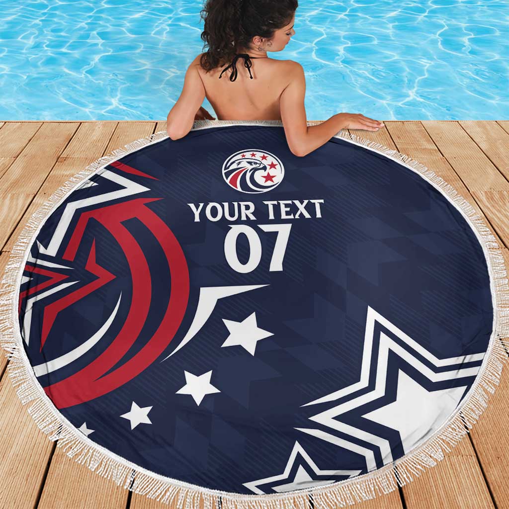 Round blue beach blanket with fringe edge, circular emblem and star pattern print