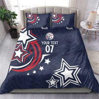 Dark blue duvet and two pillowcases with patriotic stars and 'YOUR TEXT 07' on bed