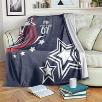 Blue custom rugby blanket draped over sofa with eagle graphic, stars, and “YOUR TEXT 07”