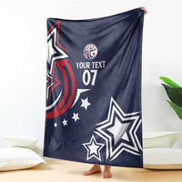 Blue rugby blanket hanging outdoors featuring eagle emblem, stars, and “YOUR TEXT 07”