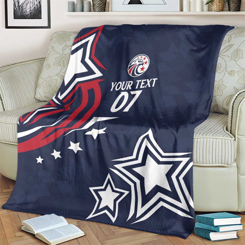 Blue rugby blanket on living room chair showing eagle graphic, stars, and “YOUR TEXT 07”