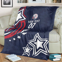 Blue rugby blanket on living room chair showing eagle graphic, stars, and “YOUR TEXT 07”