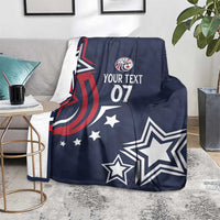 Blue custom rugby blanket on floor with eagle emblem, stars, and “YOUR TEXT 07”