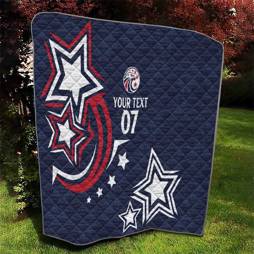 Navy-blue quilt with quilted texture, patriotic star graphics, red swoosh, text 07