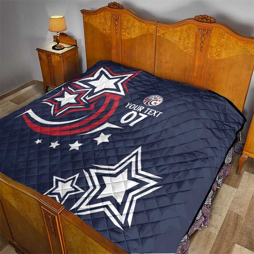 Blue custom quilt with patriotic stars and red wave detail, text 07