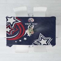 Navy blue tablecloth with eagle, star, and geometric team graphic in white and red