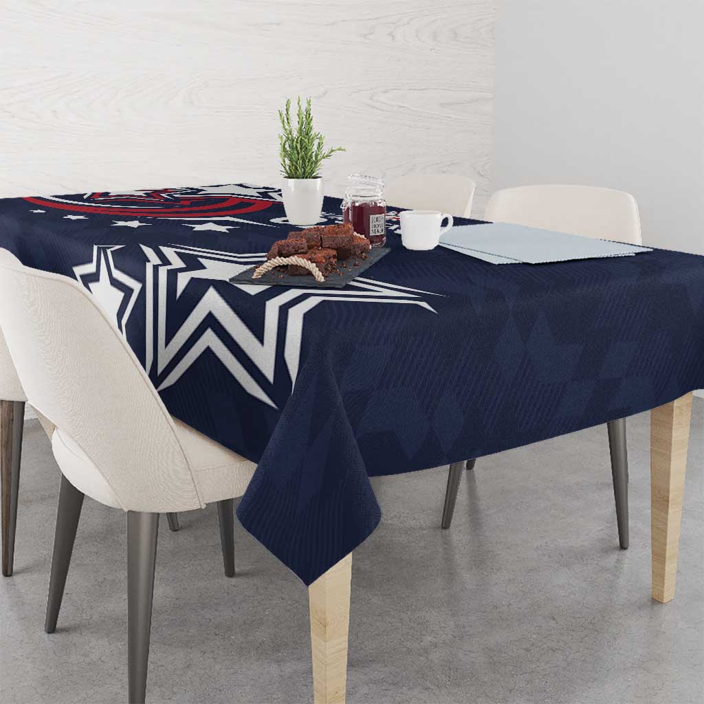 Navy blue tablecloth with large white star and geometric pattern, draped over table