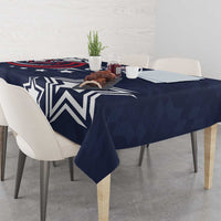 Navy blue tablecloth with large white star and geometric pattern, draped over table