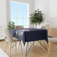 Navy blue tablecloth with white star and geometric motif, covering dining table