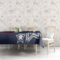 Navy blue tablecloth with large white star and stripe graphics over long table