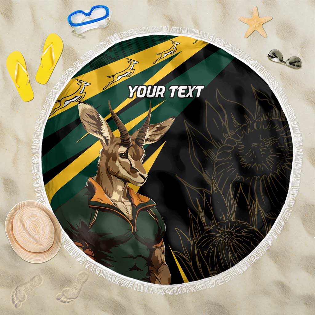 Round personalized beach blanket with springbok mascot, green and yellow stripes, fringe edge