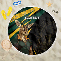 Round personalized beach blanket with springbok mascot, green and yellow stripes, fringe edge