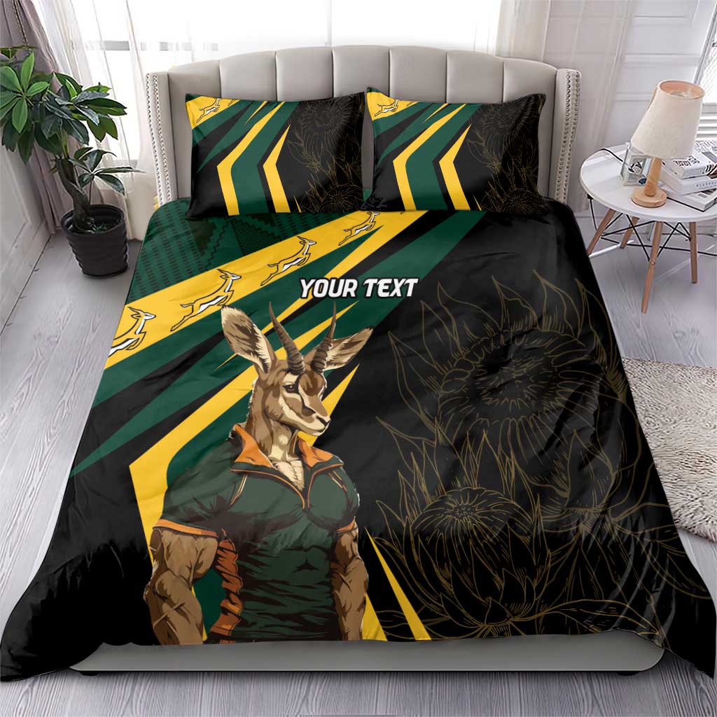 Black bedding set with springbok mascot, green/yellow stripe chevrons, and 'YOUR TEXT' pillows