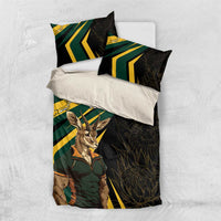 Black bedding set with springbok mascot graphic, green/yellow diagonal stripes, 'YOUR TEXT' pillows