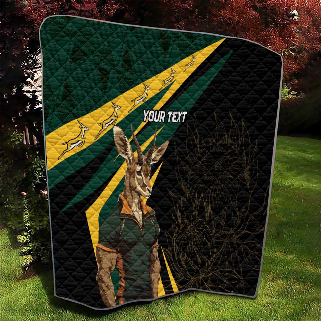 Personalised quilt on lawn, black quilt with South Africa flag print and springbok, custom text