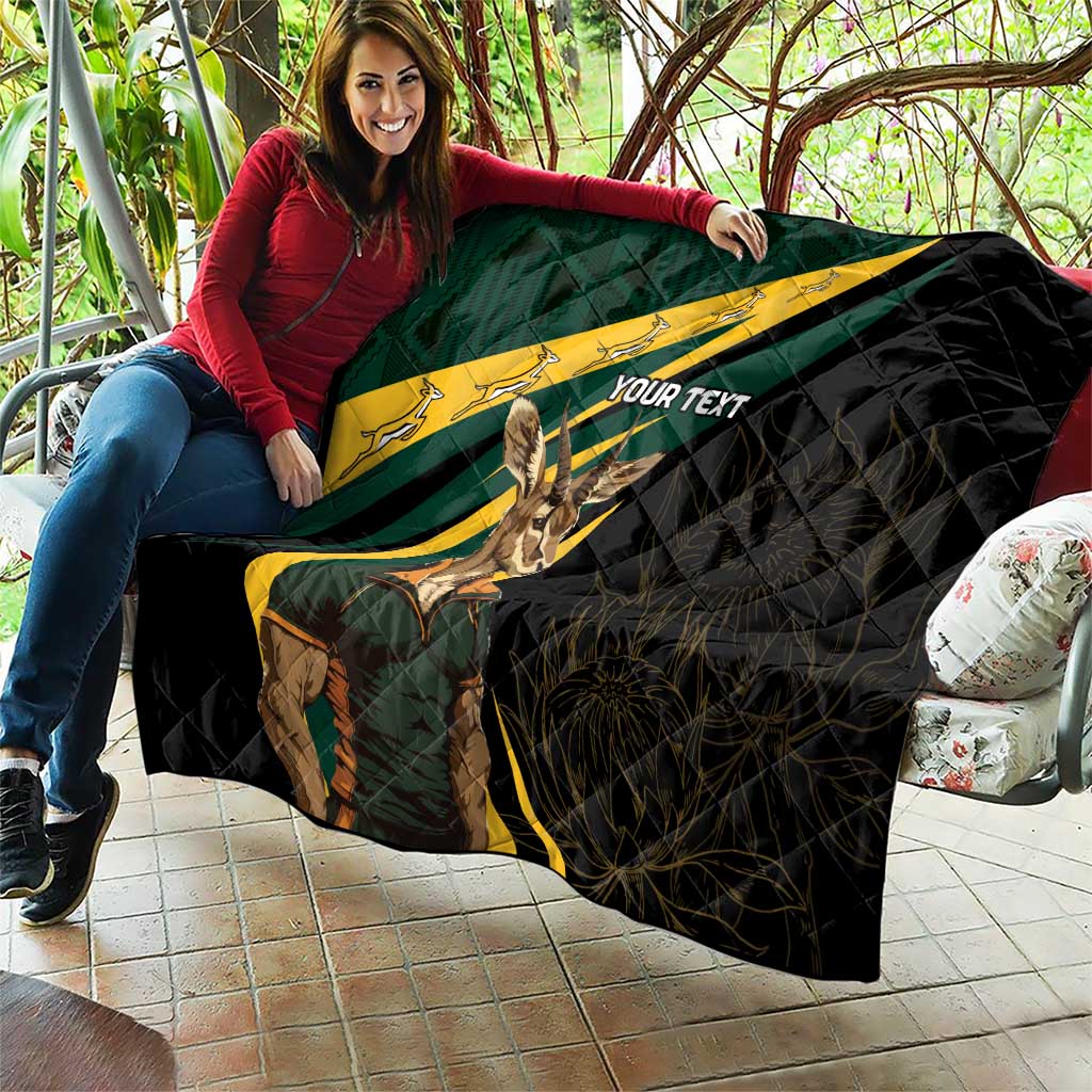 Personalised quilt draped on sofa, black with South Africa flag print, springbok graphic, custom text