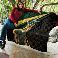 Personalised quilt draped on sofa, black with South Africa flag print, springbok graphic, custom text