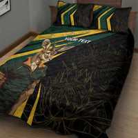 Black quilt bed set with green-yellow stripe panel and springbok mascot on quilt surface