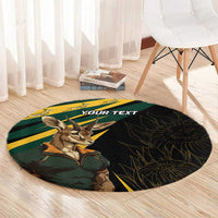 Round carpet with springbok mascot, dark base with green-and-yellow design