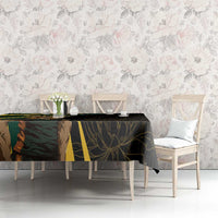 Black tablecloth on dining table with green and gold panel and leaf motifs