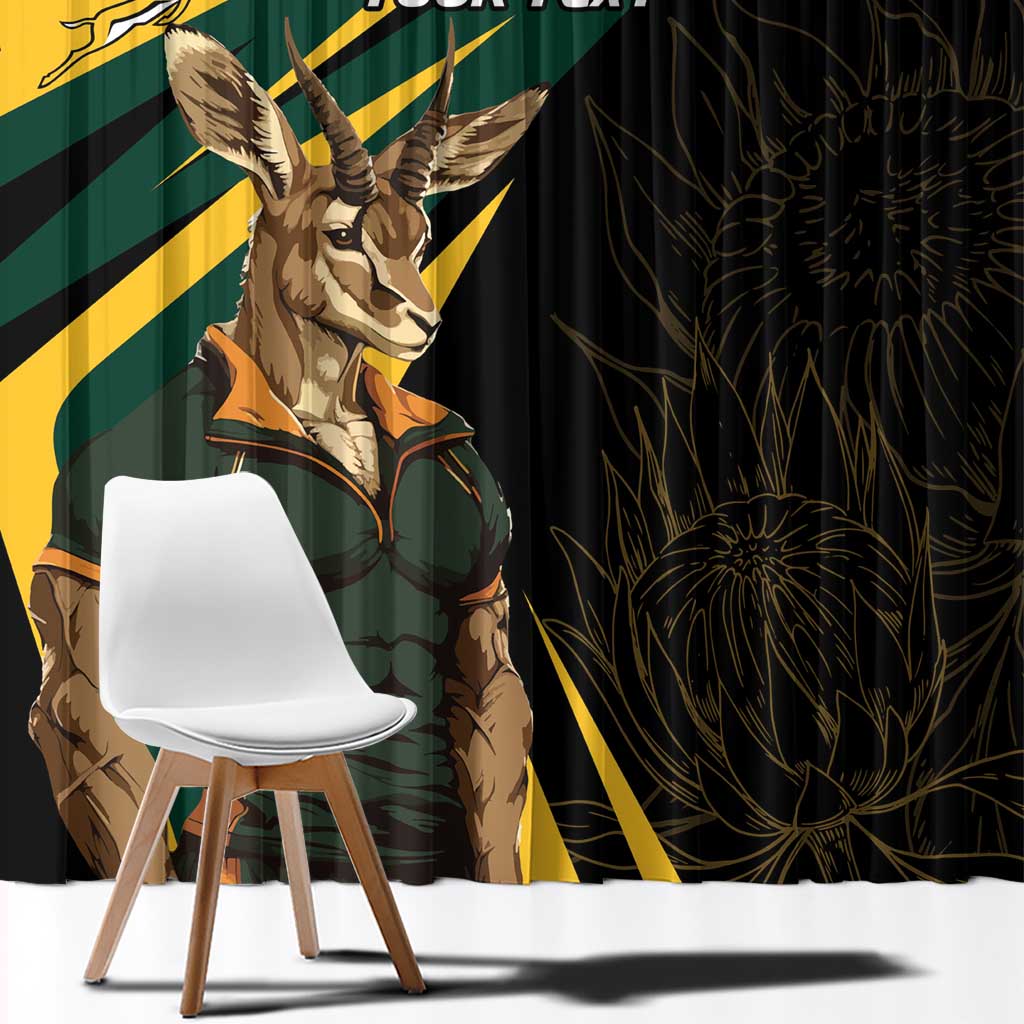 Close-up window curtain with springbok mascot illustration over dark fabric and yellow diagonal stripes.