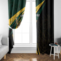 Hanging window curtains with green striped panel and dark striped panel, springbok artwork and “YOUR TEXT”.