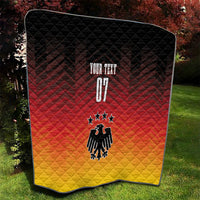 Quilt blanket with black top, red middle, yellow bottom; eagle emblem and “YOUR TEXT”