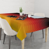 Rectangular gold yellow tablecloth with red stripes and black Germany emblem over table